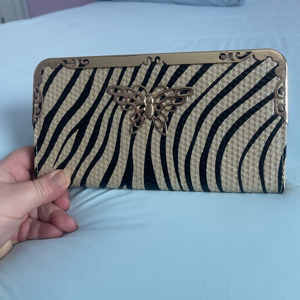 Animal print with butterfly metal details wallet. 8”x 4”x 1”